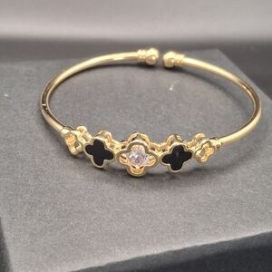 Gold-Tone Clover Cuff Bracelet with Black Inlay and Center Crystal
